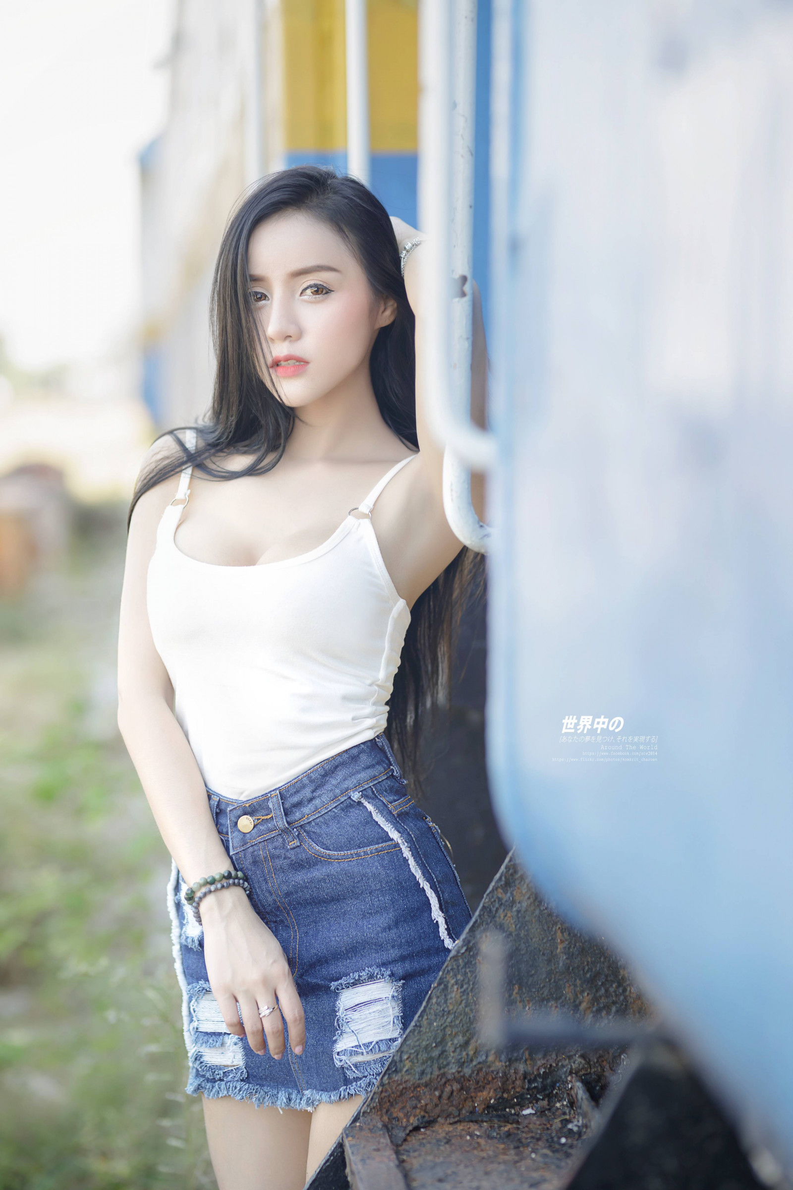 bright, casual, denim, indoor, shorts, sitting, smiling, stretching