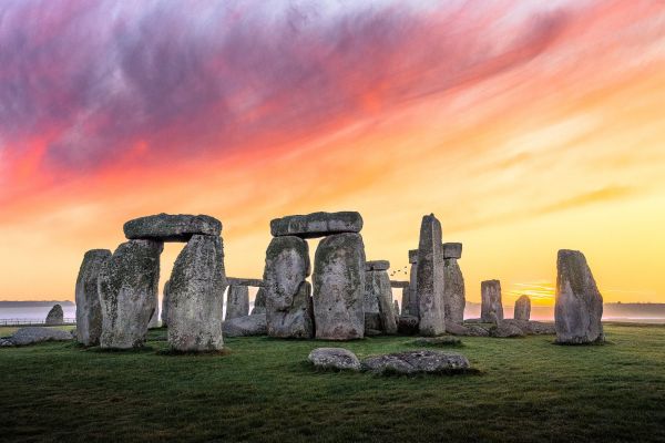 Stonehenge,prehistoric,sunset glow,rocks,grass,sky