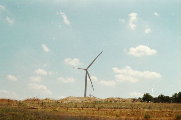 sky,wind farm,windmill,wind turbine,grassland,wind