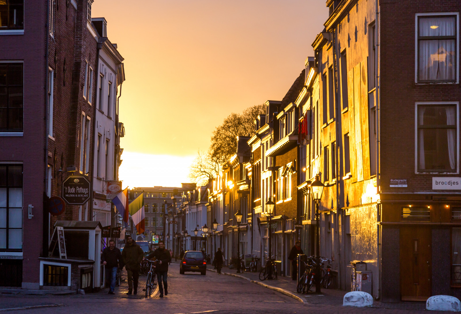 town, sky, city, neighbourhood, street, urban area, infrastructure, alley, evening, light, road, metropolis, downtown, building, night, morning, mixed use, metropolitan area, window, house, sunlight, facade, cityscape, dusk