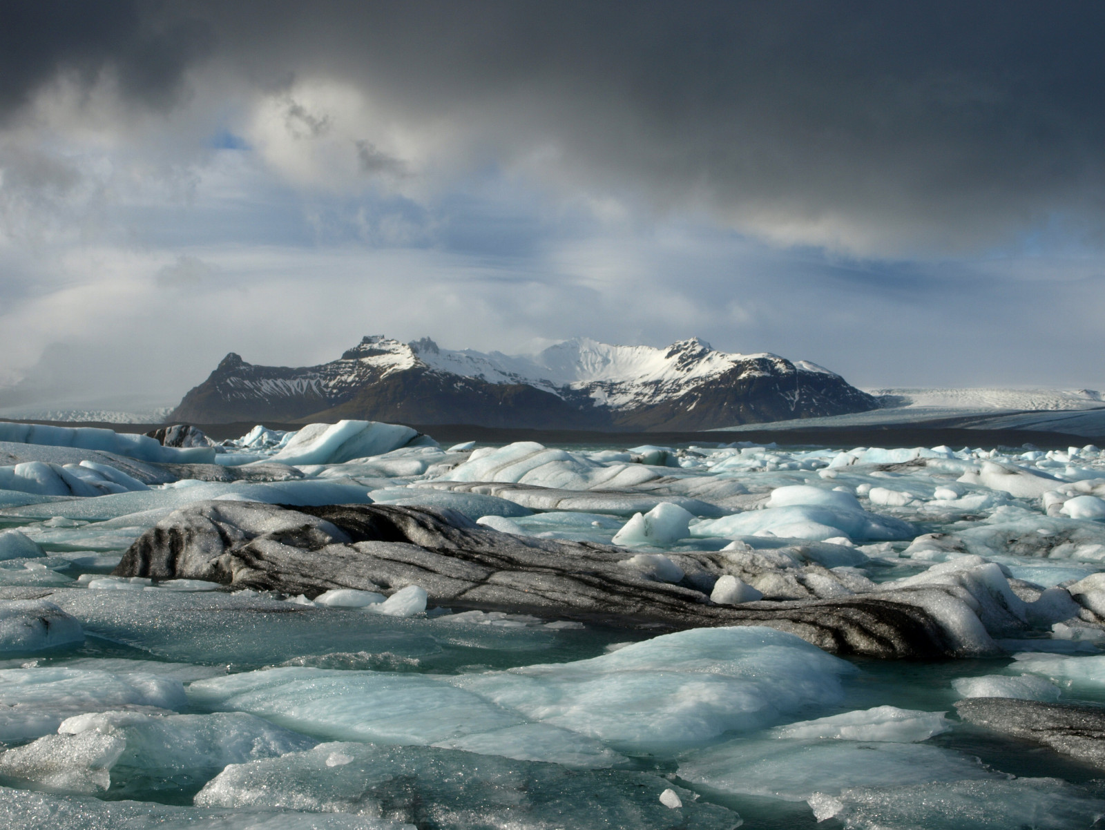 krajina, moře, nebe, sníh, zima, mraky, ledovec, bouřka, led, pobřeží, laguna, Island, Arktický, 2013, Jokulsarlon, mrak, hora, počasí, oceán, vlna, březen, ledovec, ledovců, glaciallagoon, skaftafellss sla, vatnaj kuls j gar ur, landform, geografický rys, mořská vlna, pohoří, mořského ledu, Severní ledový oceán, ledová landform