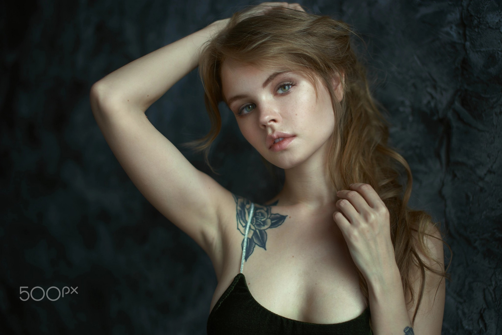 Anastasia Scheglova, looking at viewer, portrait, Russian women, blue eyes, brunette, women indoors, 500px, bare shoulders, tattoo, tank top, hand on head, bokeh, depth of field, photography