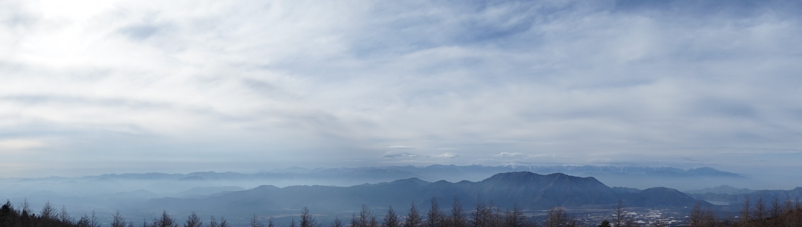 cloud, sky, atmosphere, mountain, plant, highland, Natural landscape, atmospheric phenomenon, cumulus, tree, horizon, landscape, haze, hill, mountain range, mist, grassland, valley, fog, forest, meteorological phenomenon, Massif, city, winter, ridge, evening, road, ocean, summit, tropical and subtropical coniferous forests, sound, loch, steppe, darkness, reservoir