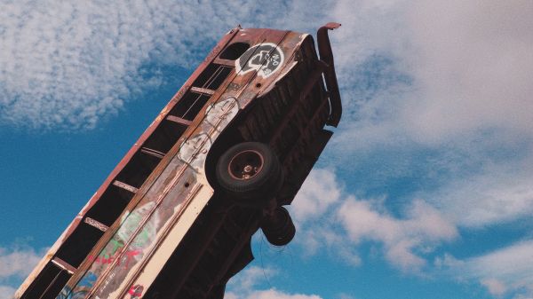 buses,clouds,minimalism,graffiti,abandoned,urban decay