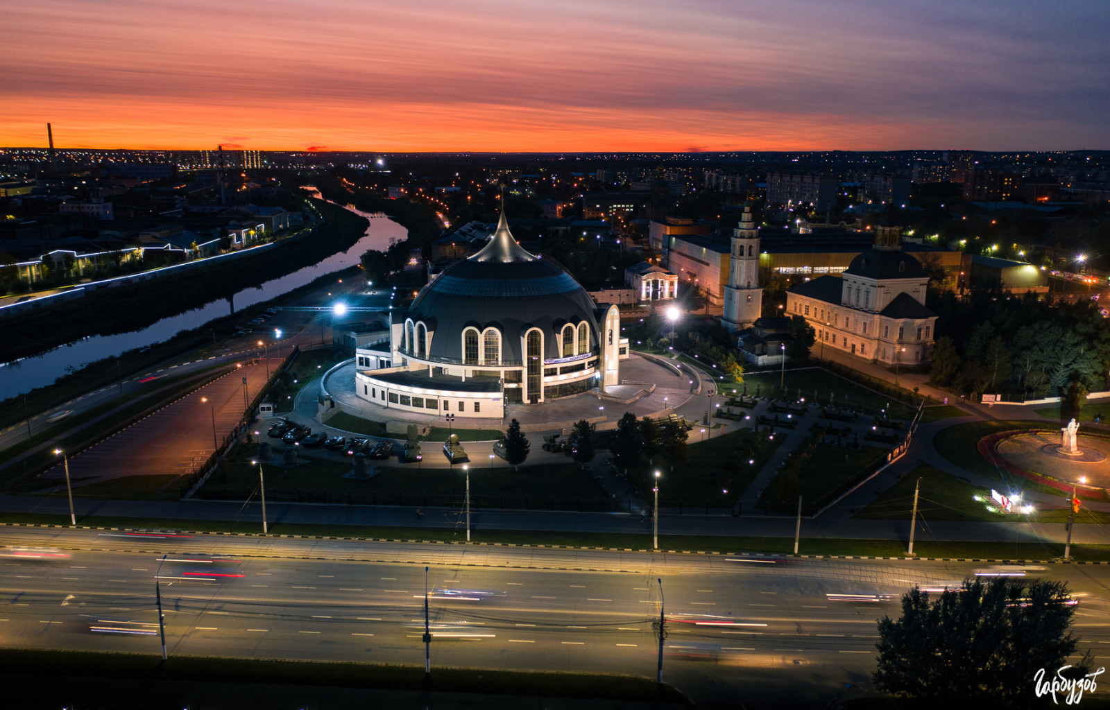 sky, building, light, infrastructure, dusk, cloud, street light, window, cityscape, landscape, residential area, waterway, metropolis, house, city, sunset, urban design, horizon, mixed use, roof, sunrise, reflection, road, downtown, evening, afterglow, midnight, aerial photography, night, winter, Tourism, tower, intersection, bird's eye view, tourist attraction, skyline, street, panorama, suburb, facade, darkness, arena, dawn, sport venue, river